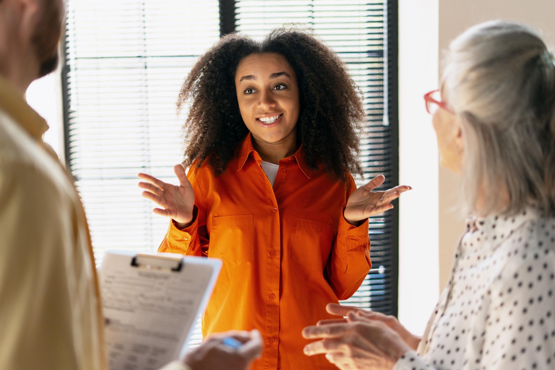 Young businesswoman explaining her point of view during a meeting with colleagues